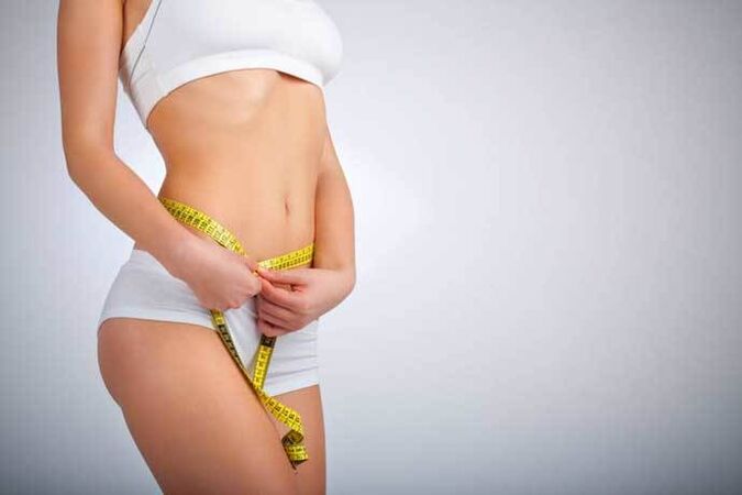 Slim Girl mesure le volume de la taille